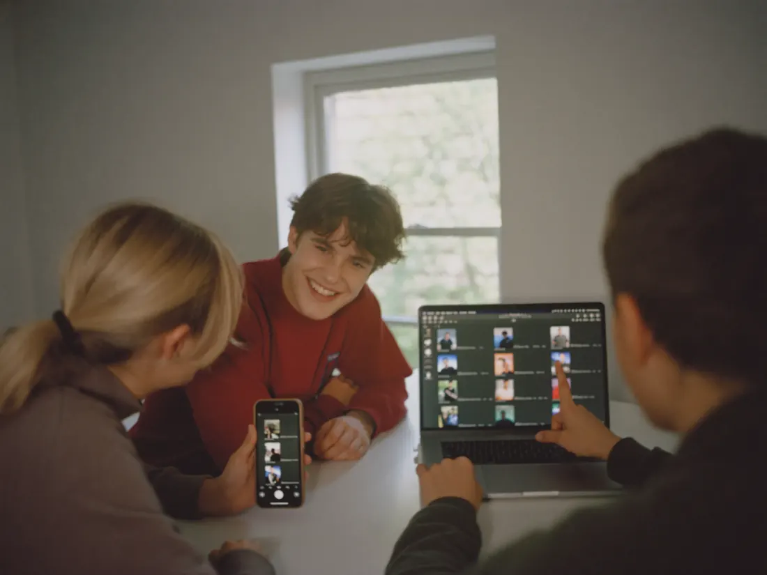 A brand team looking at short videos together